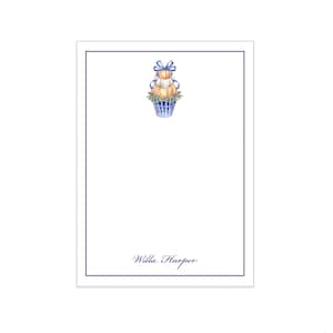 May include: A rectangular white stationery card with a thin navy blue border. At the top center is a watercolor illustration of orange pumpkins in a blue and white striped planter with a blue bow. The name Willa Harper is printed in navy blue.