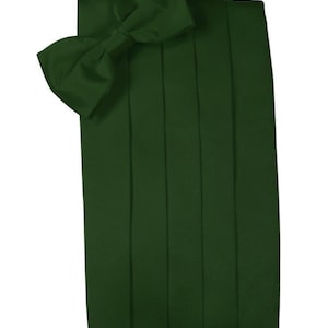 May include: A dark green satin bow tie and matching cummerbund. The bow tie is pre-tied and the cummerbund has five pleats.