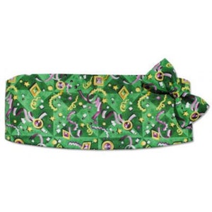 May include: A green bow tie with a confetti pattern featuring gold, purple and white accents.