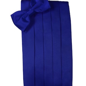 May include: Royal blue satin bow tie and matching cummerbund. The bow tie is pre-tied and the cummerbund has a pleated design.