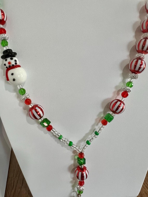 Unique One-Of-A- Kind Breakaway Lanyard - Christmas 2024 #2 - Red, White, Green & Clear Beads with 1 Ceramic Snowman Bead