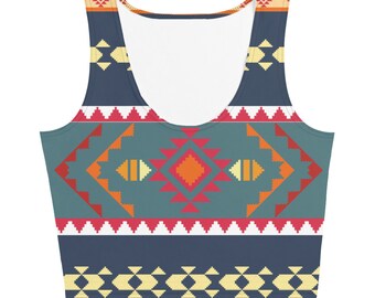 May include: A blue tank top with a geometric pattern in shades of red, orange, yellow, and white. The pattern is reminiscent of Native American designs.