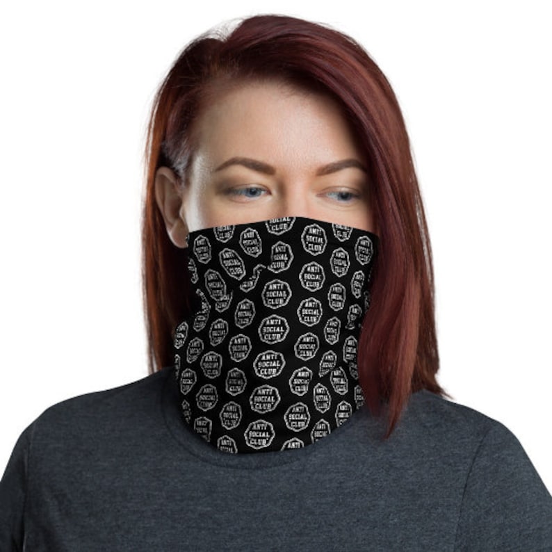 May include: A black face mask with a white repeating pattern of the words "Anti Social Club".