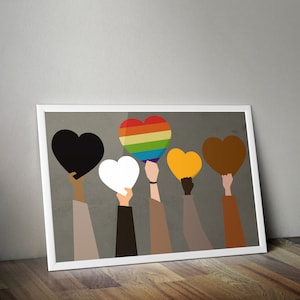 May include: Five hands holding up hearts in different colors, including rainbow, black, white, brown, and yellow. The hands are brown, white, and black.