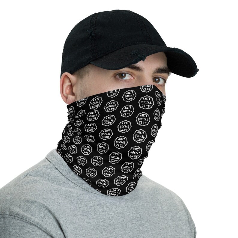 May include: Black face mask with a white repeated pattern of "Anti Social Club" text in a circle.