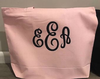 Bolso monograma con cierre de cremallera