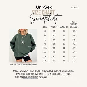 The image is a size chart for a sweatshirt, showing the measurements for different sizes.