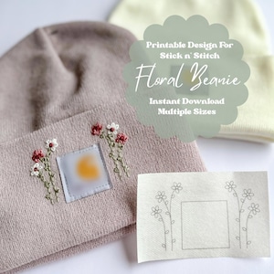 May include: Printable design for a floral beanie with a stick and stitch pattern. The design includes a small square with a yellow circle in the center and three floral stems on each side. The design is available in multiple sizes and is an instant download.