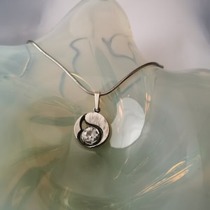 Necklace in silver and rock crystal stone design by Karl Laine for Sten & Laine Finnfeelings, Turku Finland.
