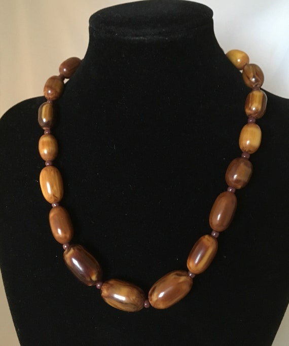 Brown Bakelite marble necklace, with small glass b