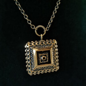 Necklace with pendant by the artist Pentti Sarpaneva in bronze  for Turun Hopia  Finland.
