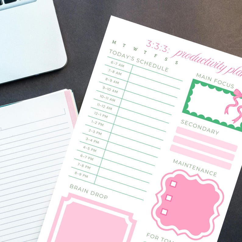 May include: A white productivity planner with a pink and green design. The planner includes sections for scheduling, main focus, secondary tasks, and maintenance. The text "3:3:3: productivity plan" is visible at the top.