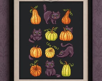 May include: A framed cross stitch pattern featuring black cats and various pumpkins in orange and yellow hues on a dark background. The text at the top reads PDF cross stitch pattern, and the bottom includes Maria Brovko and CutePatternsByMaria.