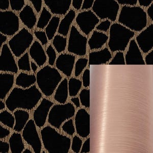 May include: Black fabric with a gold animal print pattern. A close-up of the fabric shows a smooth, light pink thread.