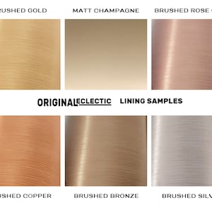 K&ouml;nnte beinhalten: Sechs verschiedene Farbmuster von geb&uuml;rsteten Metalloberfl&auml;chen. Die Farben sind geb&uuml;rstetes Gold, mattes Champagner, geb&uuml;rstetes Ros&eacute;gold, geb&uuml;rstetes Kupfer, geb&uuml;rstetes Bronze und geb&uuml;rstetes Silber.