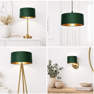 May include: A selection of green velvet lampshades with gold interiors. The lampshades are shown on a table lamp, a pendant light, a floor lamp, and a wall sconce. The lamps have gold-coloured bases and frames, creating a luxurious aesthetic.