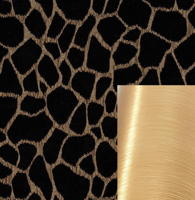May include: Black fabric with a gold animal print pattern. A close-up of the fabric shows the texture and sheen of the gold thread.