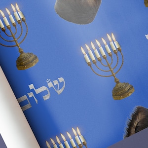 May include: A blue background with a repeating pattern of a menorah with lit candles, the Hebrew word "Shalom" and a furry black hat.