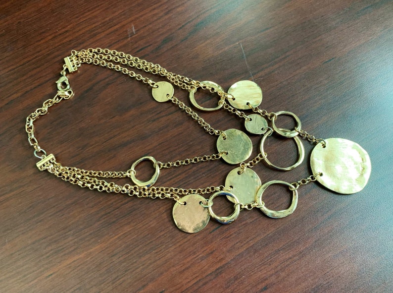 Multi stranded golden tone necklace