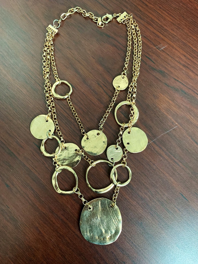 Multi stranded golden tone necklace