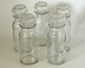 1950's-1990's set of 5 glass apothecary or spice jars with starburst lids vintage kitchen or vanity storage made by Owens Illinois
