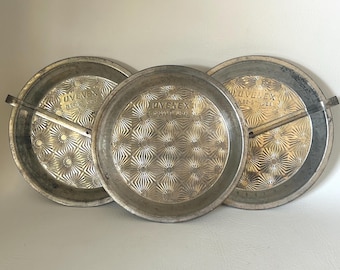 1950's group of 3 Ovenex pie pans with starburst pattern vintage textured baking pans 2 pans have slide release