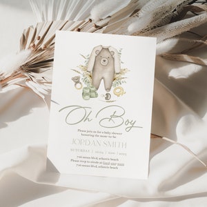 May include: A baby shower invitation with a watercolor illustration of a bear wearing a onesie. The text reads "Oh Boy" and includes the name "JORDAN SMITH" and the date and time of the event.