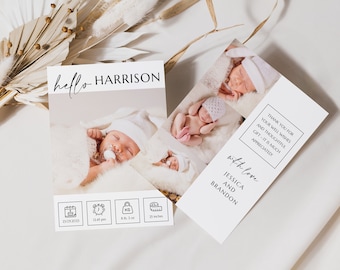 May include: A white card with black text announcing the birth of Harrison. The card includes a photo of the baby, the date and time of birth, weight, and length. The text reads "hello HARRISON" and "with love JESSICA AND BRANDON".