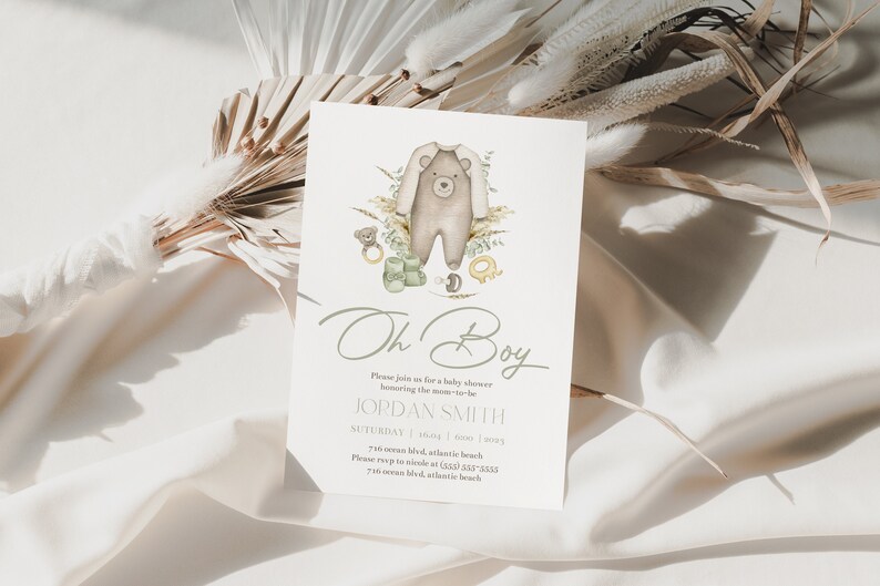 May include: A baby shower invitation with a watercolor illustration of a bear wearing a onesie. The text reads "Oh Boy" and includes the name "JORDAN SMITH" and the date and time of the event.
