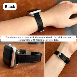 May include: Black leather watch band with a silver buckle. The band is shown on a wrist and on a table. The text "Black" is visible in the top left corner of the image. The text "The photos were taken with the Apple Watch, but all bands are compatible with Fitbit Inspire models." is visible at the bottom of the image.