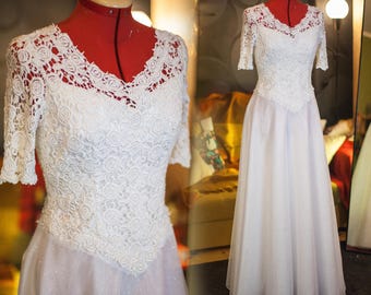 Robe de mariée en dentelle faite main délicate et scintillante