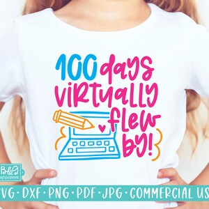 May include: A white t-shirt with a colorful graphic that says "100 days virtually flew by!" with a laptop and pencil illustration.