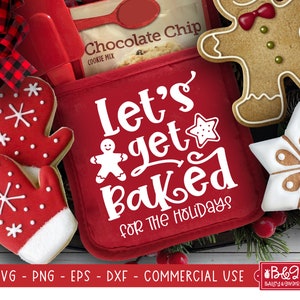 May include: Red oven mitt with the text "Let's get baked for the holidays" in white. The oven mitt is surrounded by gingerbread cookies, a snowflake cookie, and a bag of chocolate chip cookie mix.