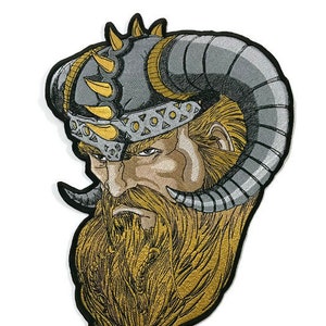 May include: Embroidered patch of a Viking warrior with a horned helmet, a long beard, and a fierce expression. The helmet is decorated with gold spikes and the beard is a golden colour.