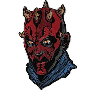 May include: Embroidered patch featuring a red and black illustration of Darth Maul's face with horns. The background is blue.