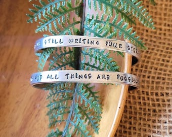 God is still writing your story | Hand stamped aluminum cuff