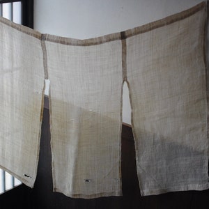 A natural-colored linen noren curtain from the early Showa period.