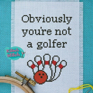 Può includere: Schema di punto croce con il testo "Obviously you're not a golfer" e una palla da bowling rossa e birilli bianchi.