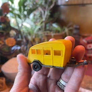 Vintage Tootsie Toys yellow trailer