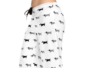 May include: White pajama pants with a black and white dachshund print.