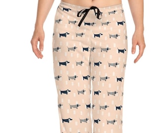 May include: Peach-colored pajama pants with a repeating pattern of black and white dachshunds.