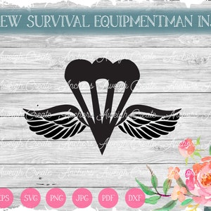 May include: Black and white silhouette of a parachute with wings, representing an aircrew survival equipmentman insignia. The image is set against a woodgrain background with a floral design in the bottom right corner.