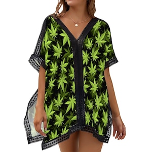 May include: Black and green short-sleeved beach cover-up with a lace trim and a marijuana leaf pattern.