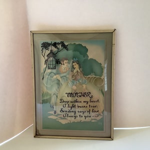 May include: Framed vintage artwork with a romantic scene and the word "MOTHER" in script. The artwork features a couple in a garden setting with a lantern and the text "Deep within my heart, A light burns true: Sending rays of love Always to you."