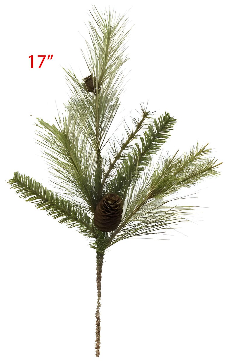 May include: An artificial pine branch, measuring 43 cm, with green needles and two brown pine cones. The branch has a textured, brown stem against a white background. The text "17" is in red.