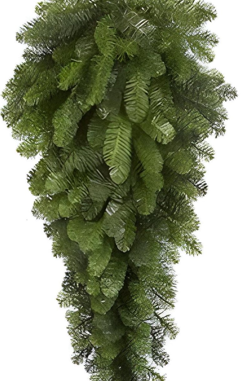 May include: A cascading, artificial evergreen garland with lush, dark green foliage. The garland features a dense arrangement of needle-like leaves, creating a full and textured appearance. Ideal for holiday decor or year-round greenery.
