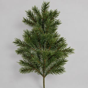May include: An artificial evergreen branch featuring dense, needle-like foliage in various shades of green. The branch has a central stem that splits into multiple smaller sprigs, each covered in realistic, pointed pine needles.