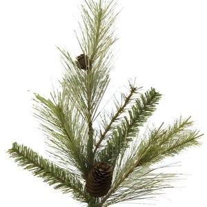 May include: A close-up of a faux pine branch with long, thin, light green needles and a brown pine cone. The branch has several smaller, darker green sprigs. The background is white.