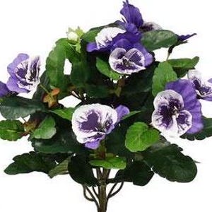 May include: A bouquet of artificial purple and white pansies with green leaves.