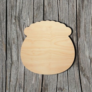 May include: A wooden cutout of a pot of gold, perfect for crafting and decorating.